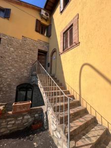 a set of stairs leading up to a building at Il sentiero per Assisi in Bastia Umbra +2 photos