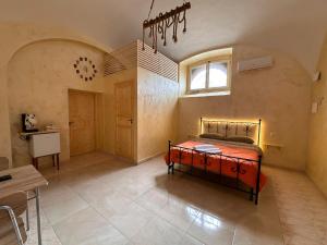 a bedroom with a bed in the middle of a room at Dea in Maddaloni