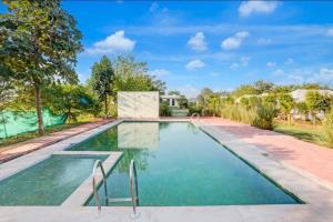 an image of a swimming pool at a house at Tiger Resort Boho in Khilchipur