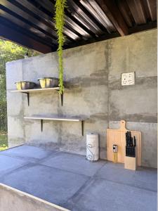 a patio with a table and a bowl on the wall at Soulfenda guest house in Graskop