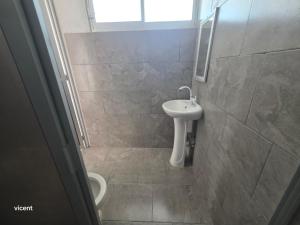 a bathroom with a sink and a toilet at Nómadas in San Luis +17 photos