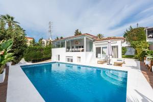 a swimming pool in the backyard of a villa at Cozy Villa With Pool In Marbella Nueva Andalucia in Marbella
