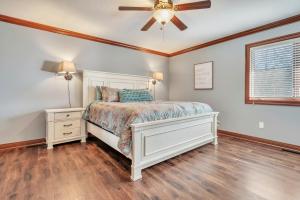 a bedroom with a bed and a ceiling fan at 84 Rohr 7B in Arnolds Park +17 photos
