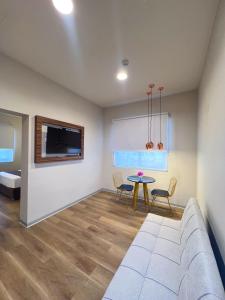 a living room with a couch and a table at DM Hoteles Nasca in Nazca