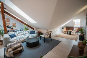 a living room with a couch and a table at Premium Design Loft - Old Town in Košice