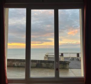 a window view of the ocean from a room at L'horizon d'Ault, prêt à séjourner, draps & serviettes inclus, lits faits à l'arrivée in Ault