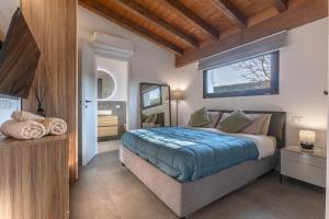 a bedroom with a large bed and a window at Suite Home Ferrara in Ferrara