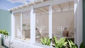a balcony with a view of the ocean at Lina's Room in Cinisi