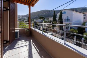 a balcony with a view of a city at Villa Elysia in Porto Rafti