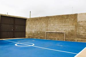 a basketball court in a building with a basketball hoop at Outra Vida in Mértola