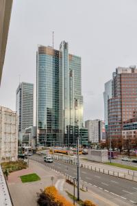 a city skyline with tall buildings and a highway at Pereca City Centre Studios by Arrenda in Warsaw