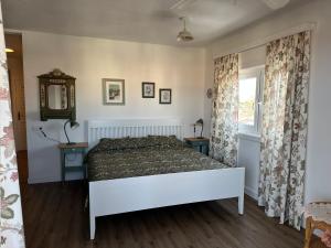 a bedroom with a bed and a window at Cozy Studio with Seaview in Costa Del Silencio +29 photos