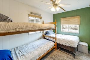 a bedroom with two bunk beds and a window at Walk to Loop Trail! East Wenatchee Basecamp in East Wenatchee