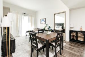 a living room with a dining room table and a couch at Brilliant 2BD condo in Los Angeles +36 photos