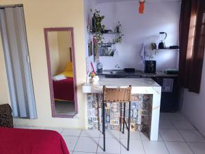 a kitchen with a sink and a mirror in a room at Studio Jéssica in Arunta +2 photos
