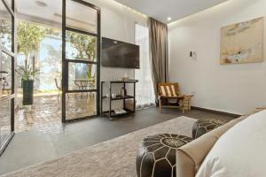 a living room with a couch and a large window at Dariana guesthouse in Marrakesh