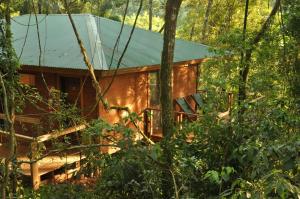 a wooden cabin in the middle of a forest at Moconá Virgin Lodge in Moconá Falls