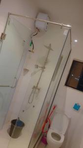 a bathroom with a toilet in a room at Knock inn luxury apartment in Benin City +16 photos