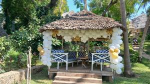 a gazebo with a bunch of balloons at Villa Tewa in Mtwapa