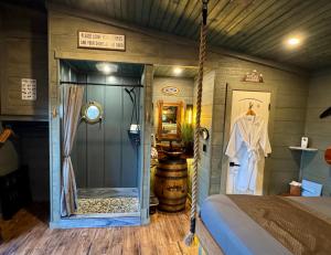a room with a bed and a door in a room at "Air Fort One" Aviation-Themed Luxury Treehouse Near Dollywood & Pigeon Forge in Sevierville +42 photos