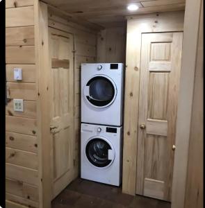a laundry room with a washer and dryer at Mountain View Cottage in Wilmington +5 photos