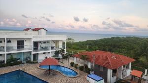 an aerial view of a resort with a swimming pool at Apt Vista para o Mar in Conde