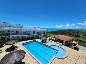 an aerial view of a resort with a swimming pool at Apt Vista para o Mar in Conde