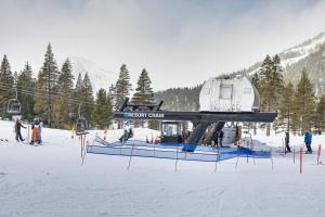 a ski lift with a house on it in the snow at Everline Resort Studio w/ Luxury Resort Perks in Olympic Valley