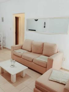 a living room with a couch and a table at Casa Sofía in Paraná