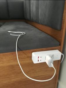 a nintendo wii game system on a bed at Apto completo próximo a Johnson e Johnson e Dutra in São José dos Campos