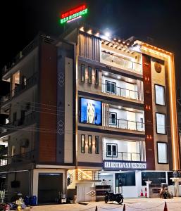 a building with a sign on the side of it at Sri RENUKA VSR Residency in Avanigadda