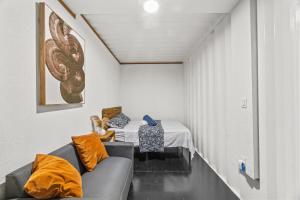 a living room with a couch and a table at Beachside 1BR Apartment Sleeps 4 in Vega Baja