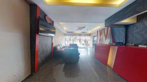an office lobby with a waiting room with a couch at Swing & Pillows - Skudai Johor in Skudai