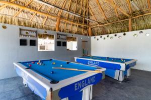two ping pong tables in a room with at Hotel Arena Beach Cartagena in Cartagena de Indias