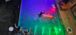 a group of people in the water at a party at Navy Medic 36 Poolvilla in Sattahip