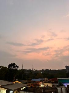 a view of a city at sunset with a sky at Global Residency in Kanjirapalli