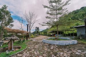 a garden with a stone circle in the middle at Serenity Busay Room 8 in Cebu City