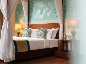 a bedroom with a bed with a canopy at 8fold by Larisa, Shimla in Shimla