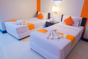 Postel nebo postele na pokoji v ubytování Asawann Hotel Nongkhai + 37 fotografií