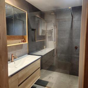 a bathroom with a tub and a sink and a shower at Prosser River view from Paradise in Orford +15 photos