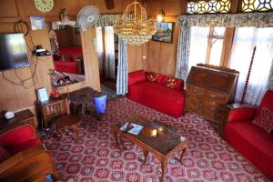 an aerial view of a living room with red furniture at La Barca Zaindari in Srinagar