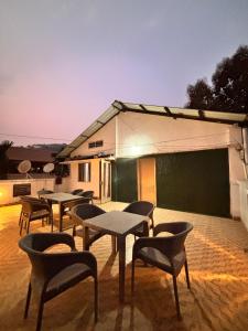 a group of tables and chairs on a patio at Hotel serenity villa in Guwahati