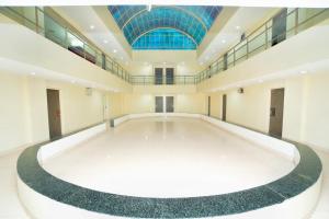 a large room with a large tub in the middle at Hotel Sai Palace Executive Lodging in Bīr