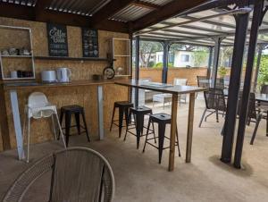 a kitchen with a table and chairs in a room at KI Caravan Park, Kingscote in Kingscote