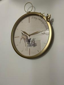a clock with a picture of a dog and a cat at Swansea Waterfront in Swansea +4 photos