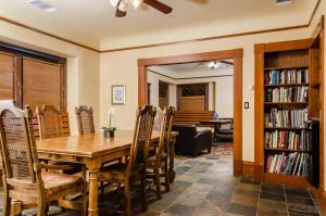 a dining room with a wooden table and chairs at Hotel Napa Valley, an Ascend Collection Hotel in Napa