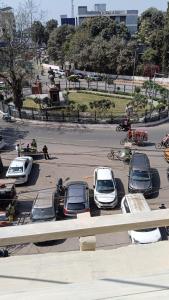 a group of cars parked in a parking lot at Atithi Stay in Patna