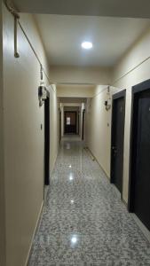an empty hallway with a long corridor with a long corridorngthngthngthngthngth at Atithi Stay in Patna