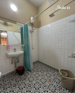 a bathroom with a sink and a shower and a toilet at Studio 61 Saltlake Sector 1 Kolkata in kolkata +17 photos