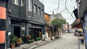 an empty street in an alley with a building at Herton Boutique Hotel in Istanbul